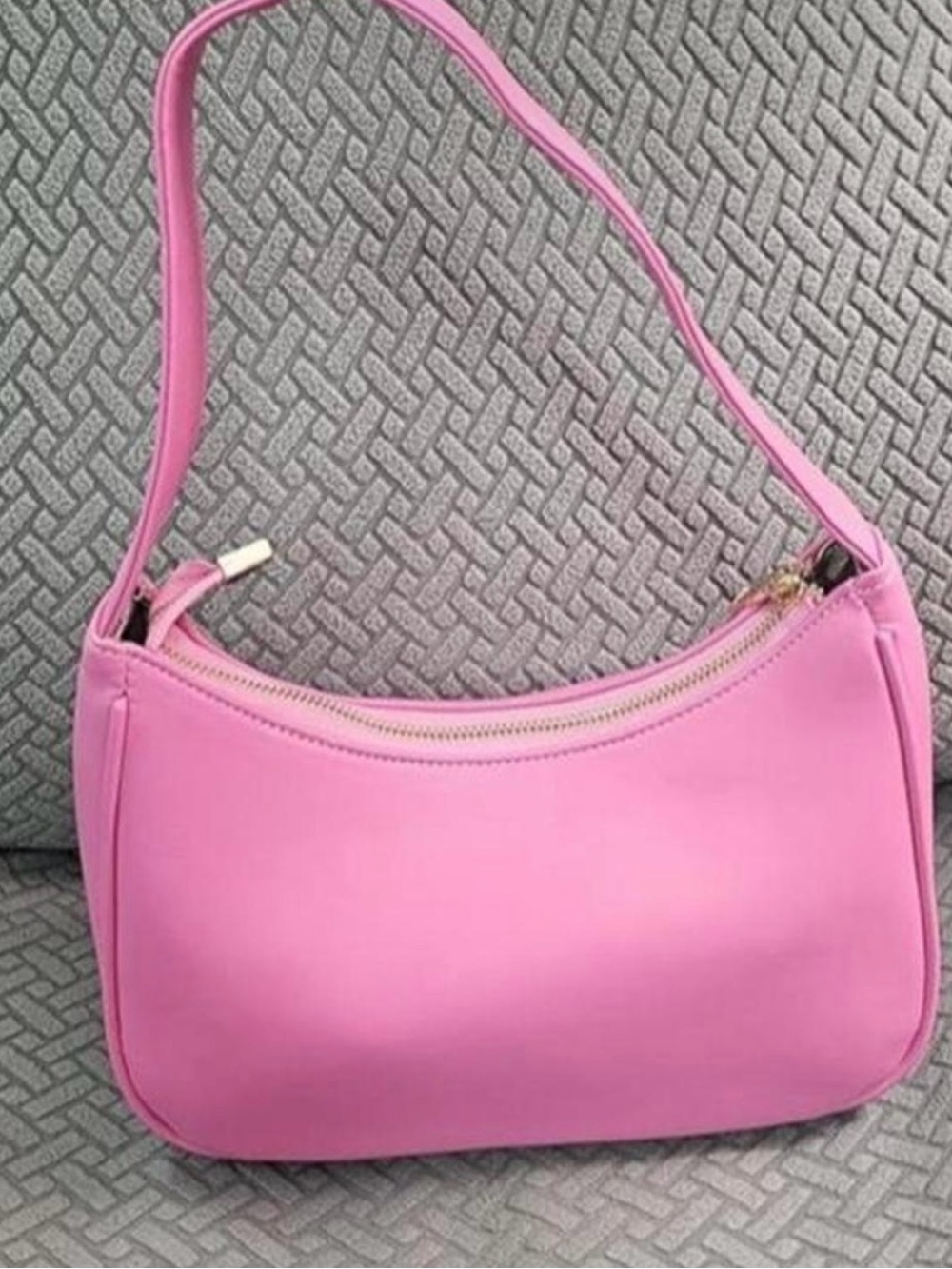 Sleek Pink Shoulder Bag with Curved Silhouette